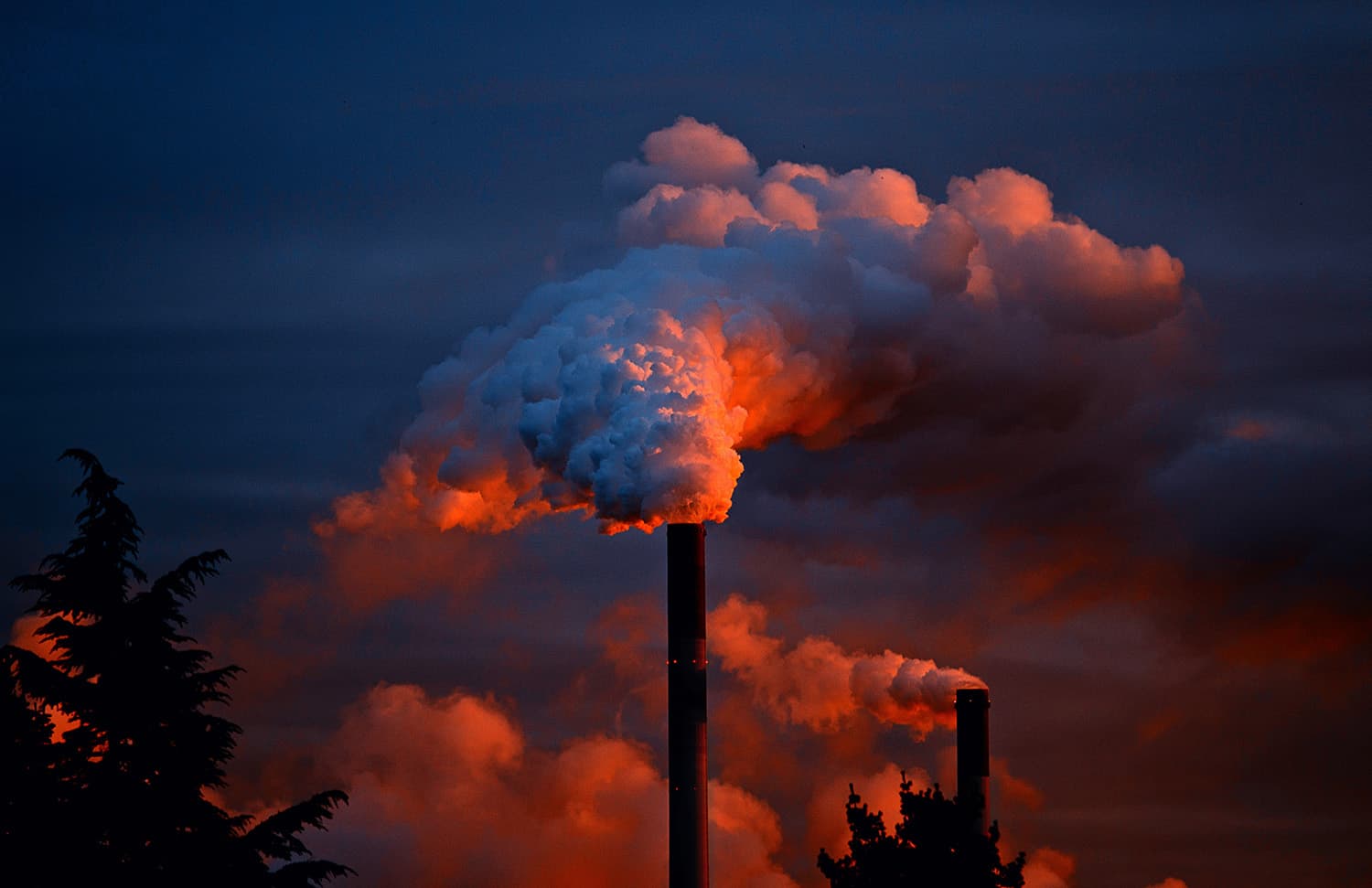 Industrial stack emitting petrochemical plumes